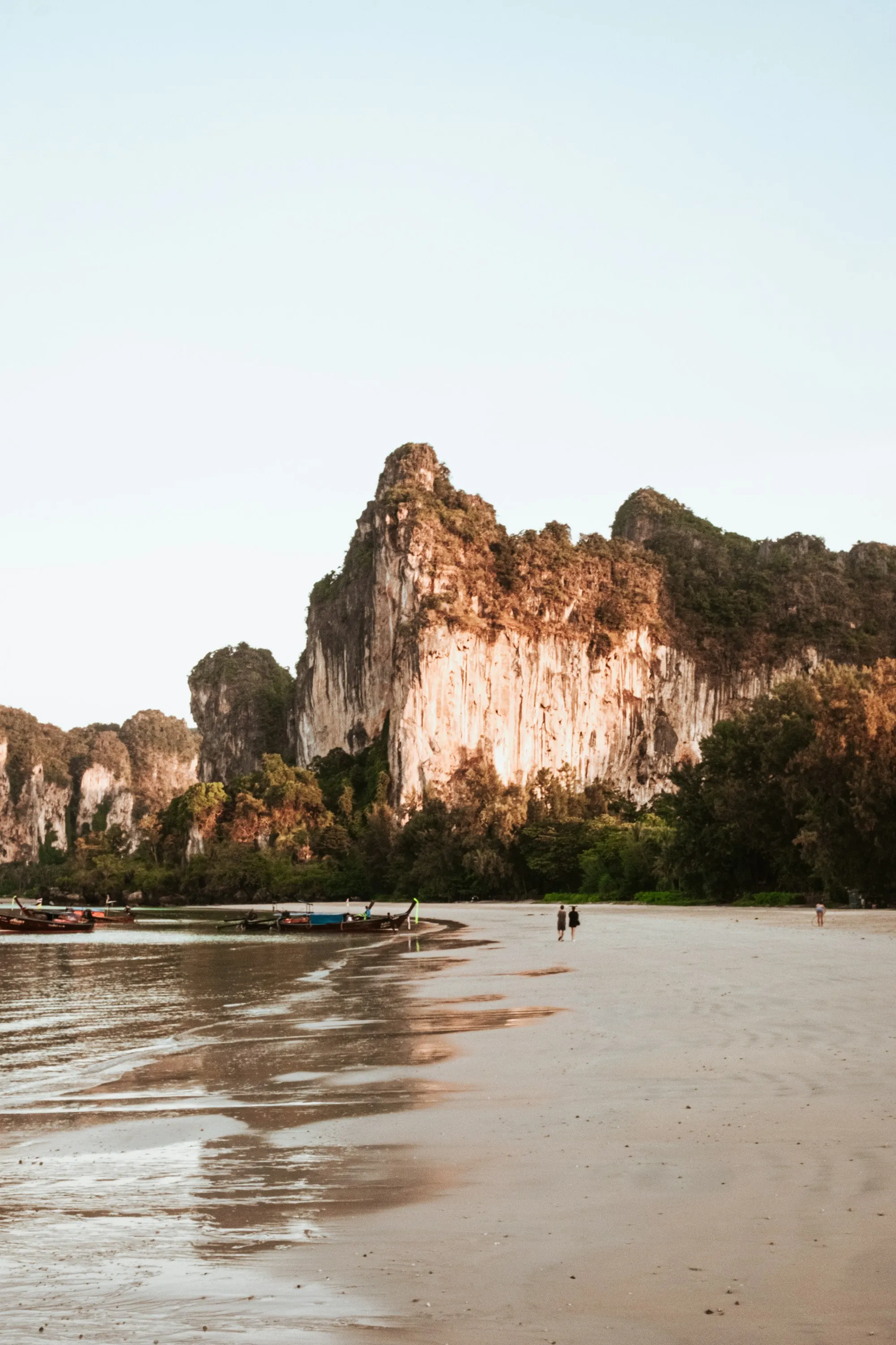 Limestone cliffs above turquoise water on the Andaman coast near Krabi